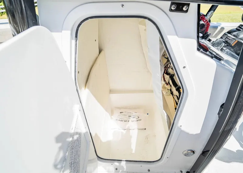 Slide: The Image of Interior view of 2025 Sea Hunt Ultra 219 boat storage compartment. - 16