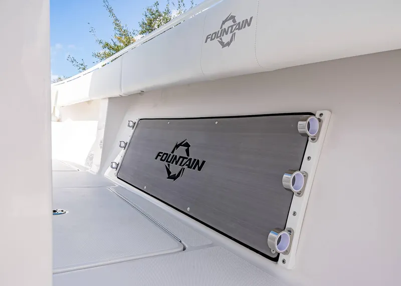 Slide: The Image of 2026 Fountain 38 TE boat interior with branded panel and rod holders. - 21