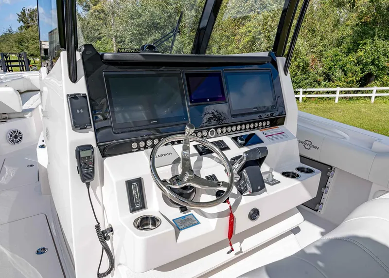 Slide: The Image of 2026 Fountain 38 TE boat dashboard with modern controls and navigation screens. - 22