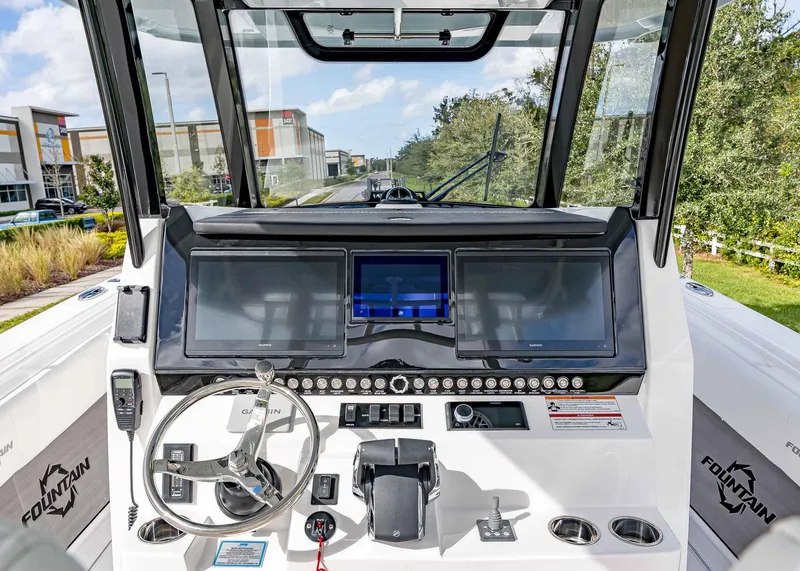 Slide: The Image of 2026 Fountain 38 TE boat dashboard with modern navigation screens and controls. - 24