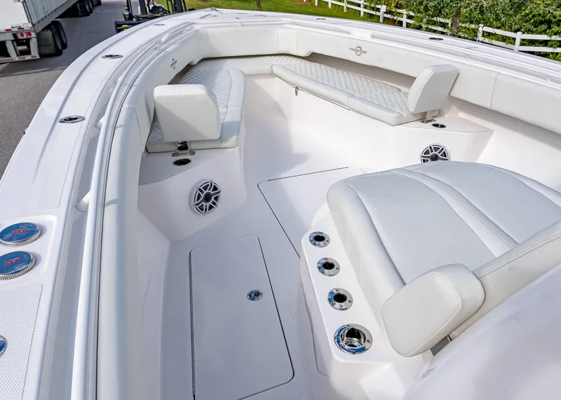 Slide: The Image of 2026 Fountain 38 TE boat interior with white seating and modern design. - 32