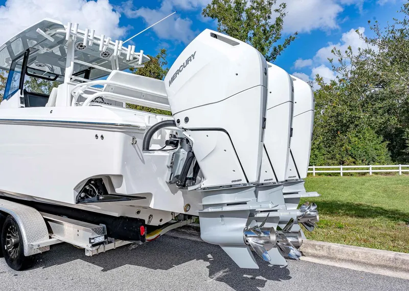 Slide: The Image of 2026 Fountain 38 TE boat with triple Mercury outboard engines on a trailer. - 4