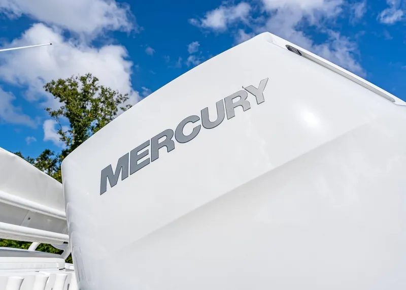 Slide: The Image of 2026 Fountain 38 TE boat with Mercury engine under blue sky. - 5