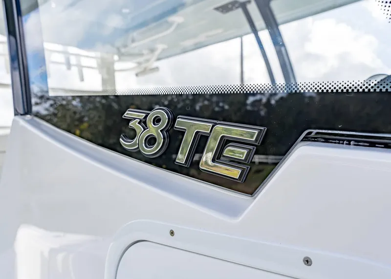 Slide: The Image of 2026 Fountain 38 TE boat logo on sleek white surface. - 9