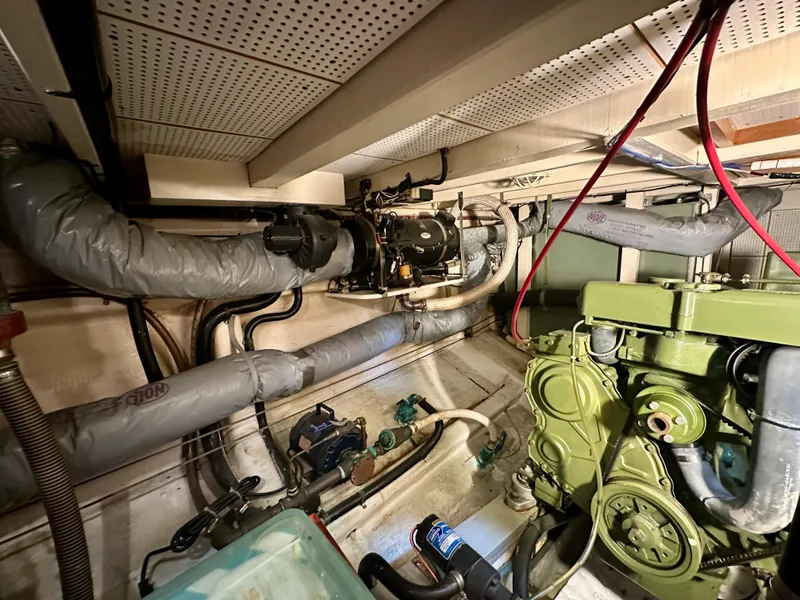 Slide: The Image of Cozy cabin interior of 1982 Grand Banks 42 Classic with wooden paneling and twin beds. - 41