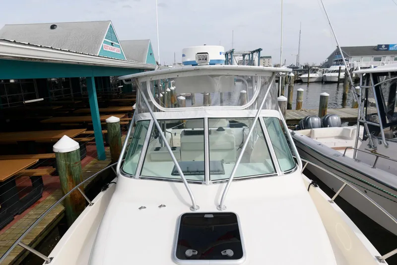 Slide: The Image of 2000 Pursuit 3070 Offshore Center Console boat docked at marina. - 14