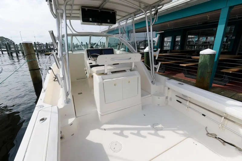 Slide: The Image of 2000 Pursuit 3070 Offshore Center Console boat docked at marina. - 5