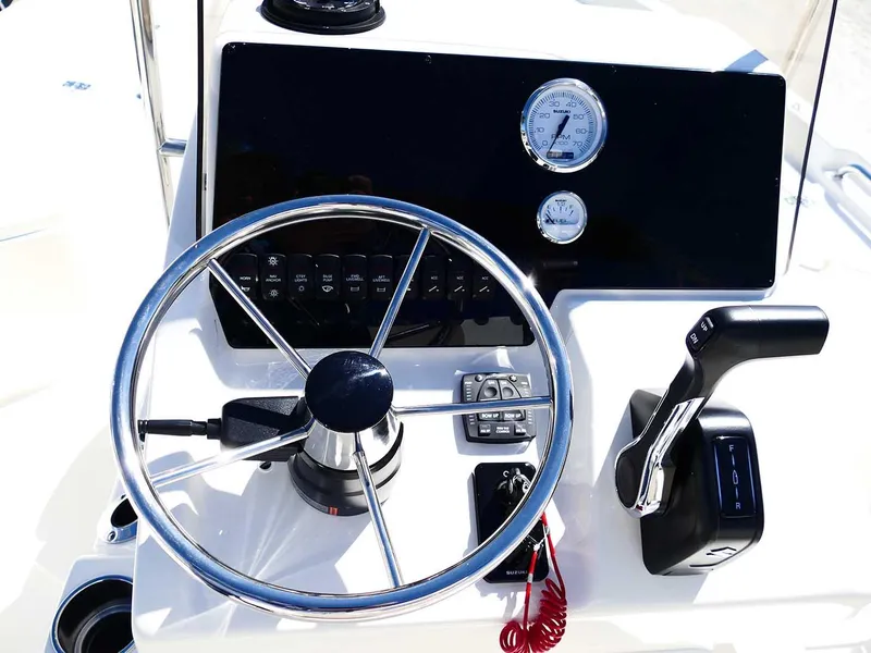 Slide: The Image of Steering console of 2025 Bulls Bay 2200 boat with gauges and controls. - 14