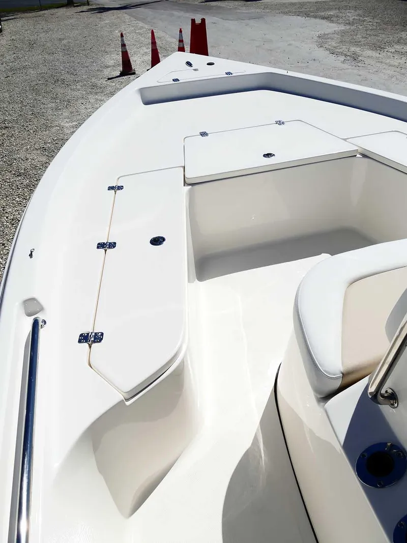 Slide: The Image of 2025 Bulls Bay 2200 boat deck with storage compartments and seating. - 20
