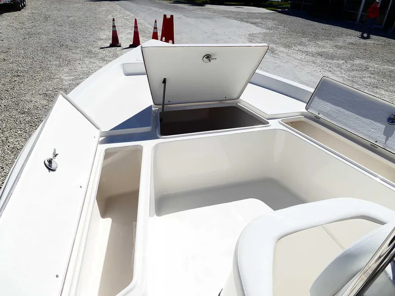 Slide: The Image of 2025 Bulls Bay 2200 boat with open storage compartments on deck. - 25