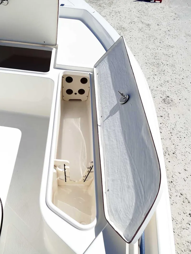 Slide: The Image of Bulls Bay 2200 boat storage compartment, open lid, 2025 model, white interior. - 28