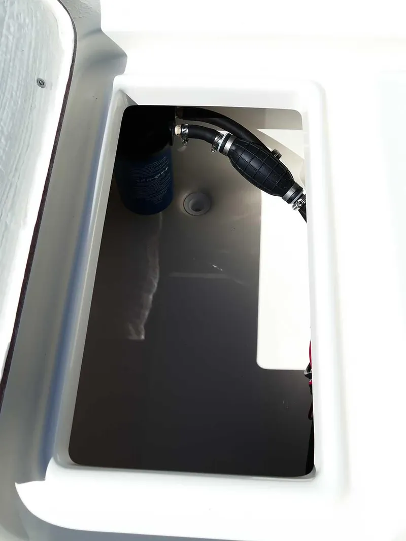 Slide: The Image of Bulls Bay 2200 (2025) boat compartment with fuel line and storage space. - 37