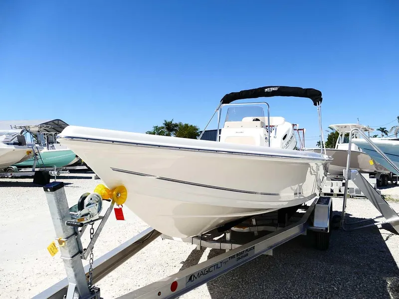 Slide: The Image of 2025 Bulls Bay 2200 boat on trailer under clear blue sky. - 5