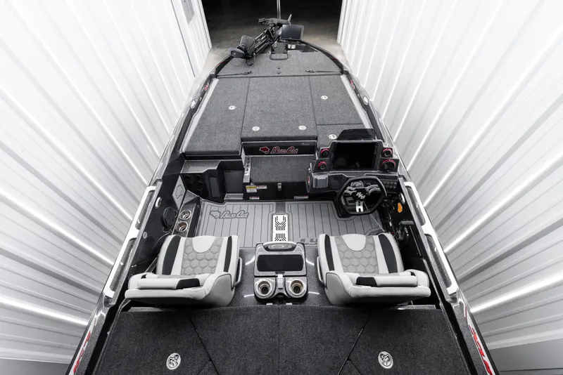 Slide: The Image of 2026 Bass Cat Lynx STS boat interior with dual seats and advanced dashboard. - 8