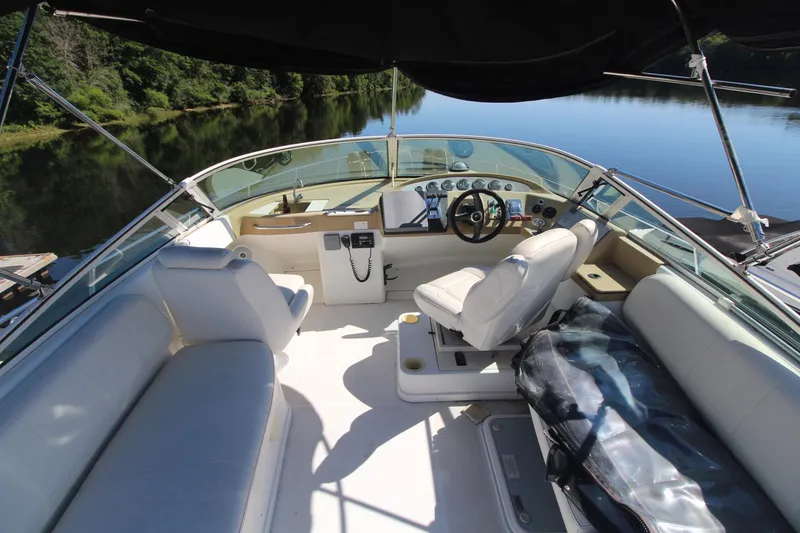 Slide: The Image of 2001 Carver 350 Mariner boat interior with helm, seating, and scenic water view. - 3
