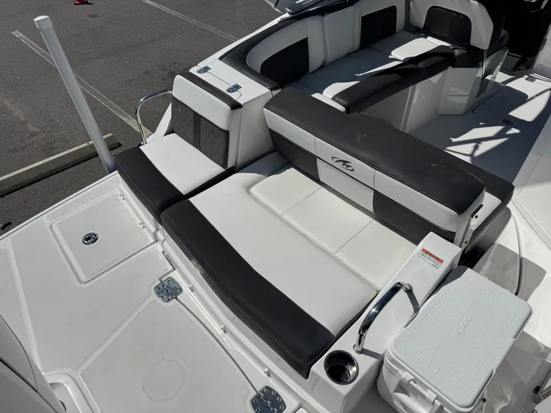 Slide: The Image of Luxury seating area on a 2020 Monterey M-65 boat, featuring sleek black and white upholstery. - 27