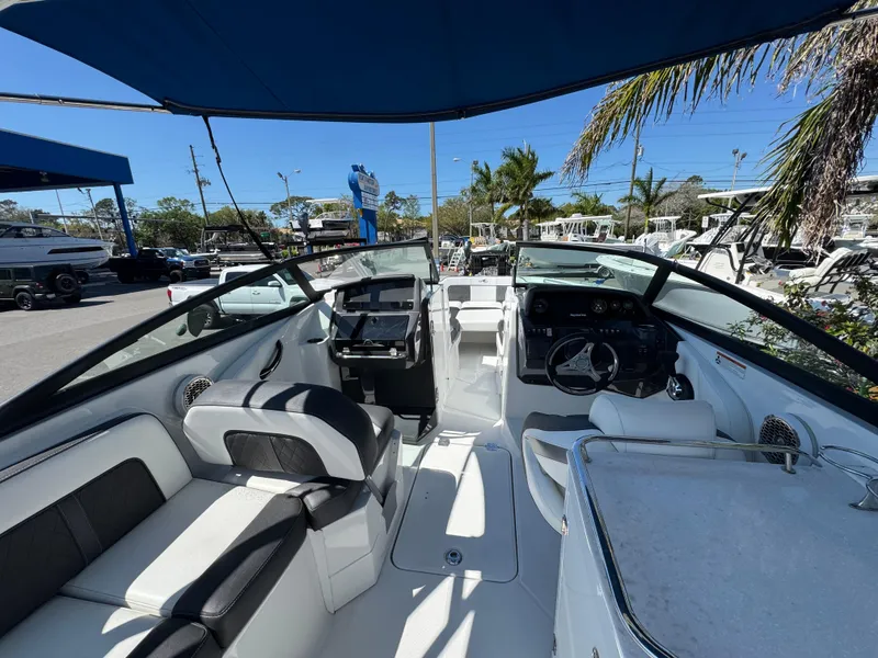 Slide: The Image of Interior view of 2020 Monterey M-65 boat with seating and steering console. - 32