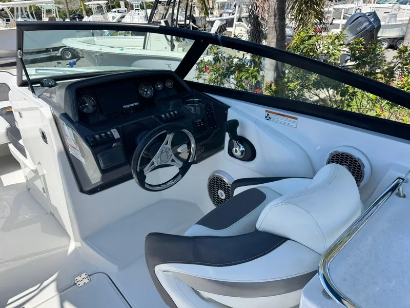 Slide: The Image of 2020 Monterey M-65 boat cockpit with steering wheel and control panel. - 34