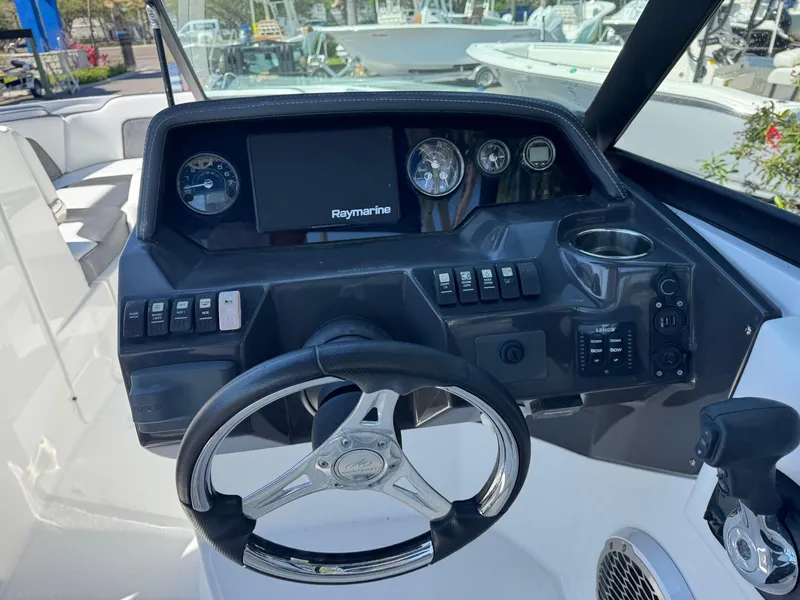 Slide: The Image of Steering console of a 2020 Monterey M-65 boat with Raymarine display. - 35