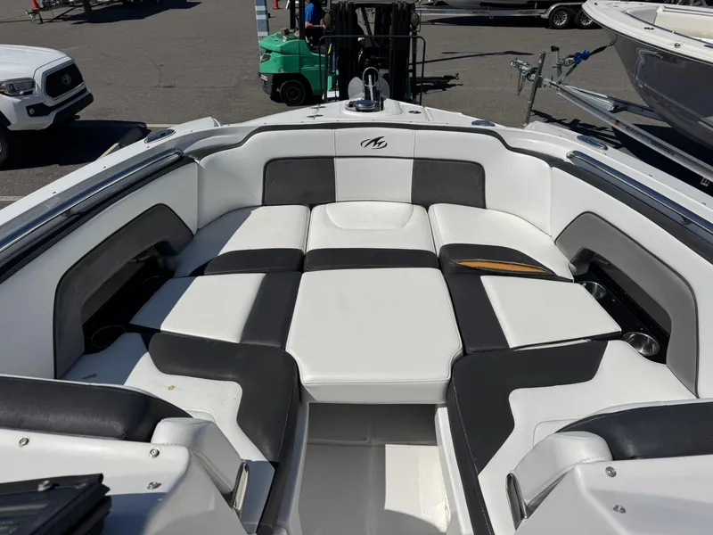 Slide: The Image of 2020 Monterey M-65 boat interior with black and white seating arrangement. - 39