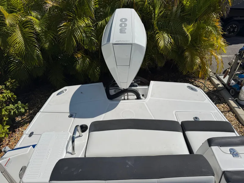 Slide: The Image of 2020 Monterey M-65 boat with powerful outboard engine, surrounded by lush greenery. - 48
