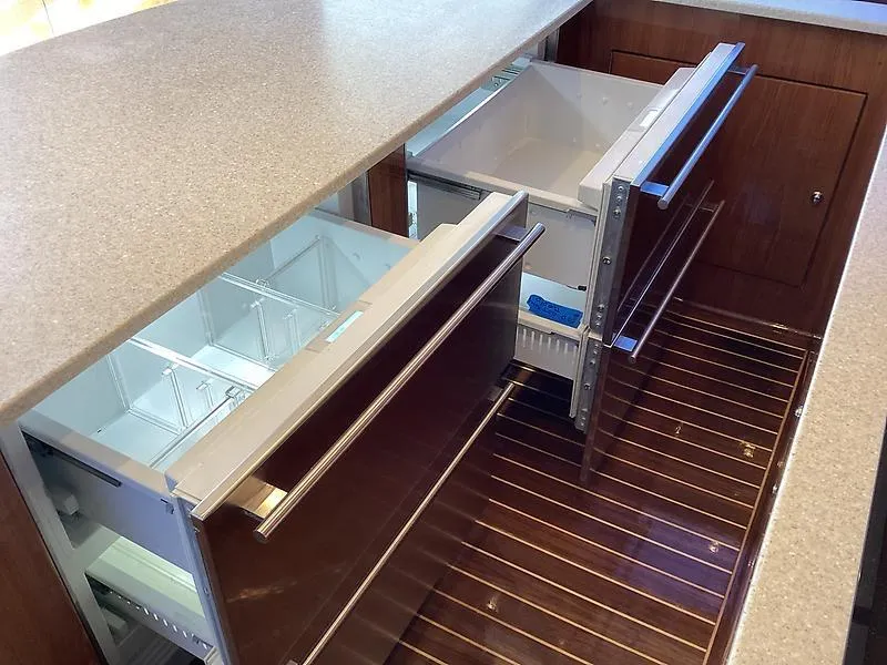 Slide: The Image of Open drawer refrigerators in a 2017 Tides 45 Sportfish yacht kitchen. - 10