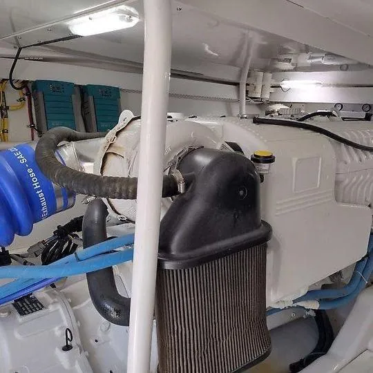 Slide: The Image of Engine room of 2017 Tides 45 Sportfish boat, showcasing mechanical components. - 17