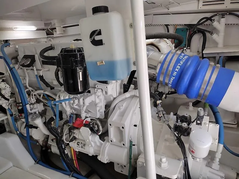 Slide: The Image of Engine room of 2017 Tides 45 Sportfish boat, featuring complex machinery and components. - 18