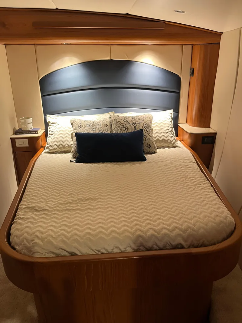 Slide: The Image of Luxurious bedroom interior of 2017 Tides 45 Sportfish yacht with elegant bedding and wood accents. - 5