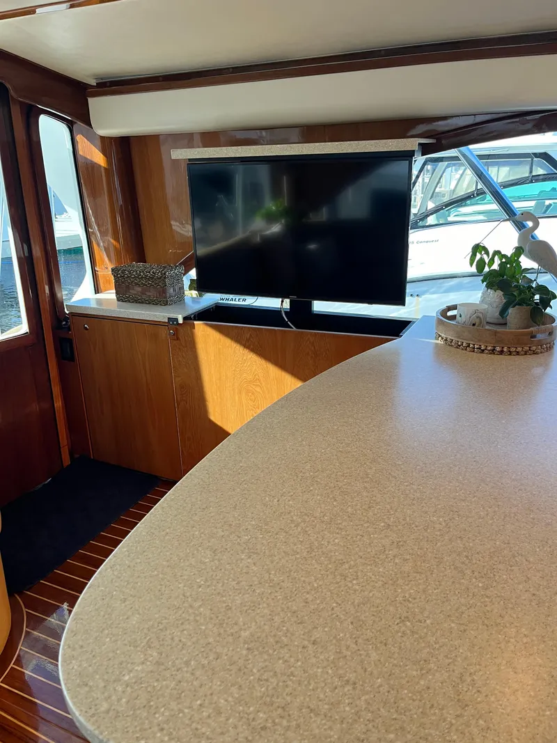 Slide: The Image of Interior of 2017 Tides 45 Sportfish yacht with TV and elegant decor. - 9