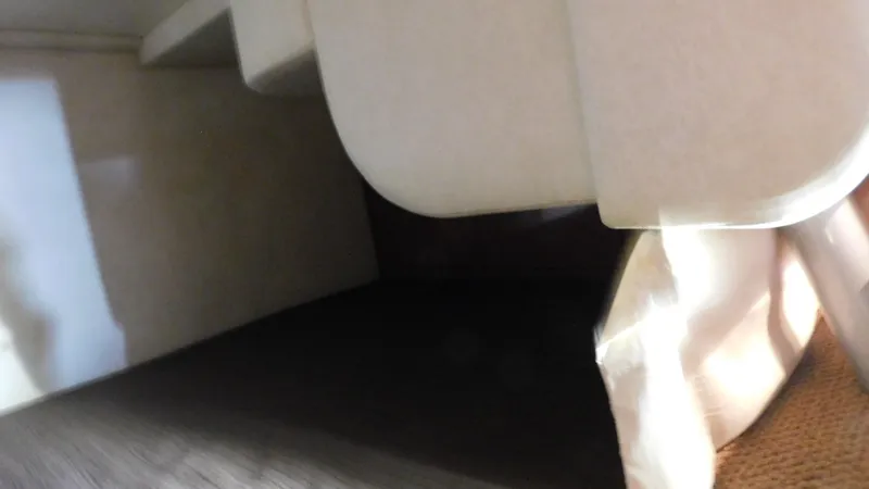 Slide: The Image of Interior view of a 2012 Sea Ray 310 Sundancer boat cabin. - 35