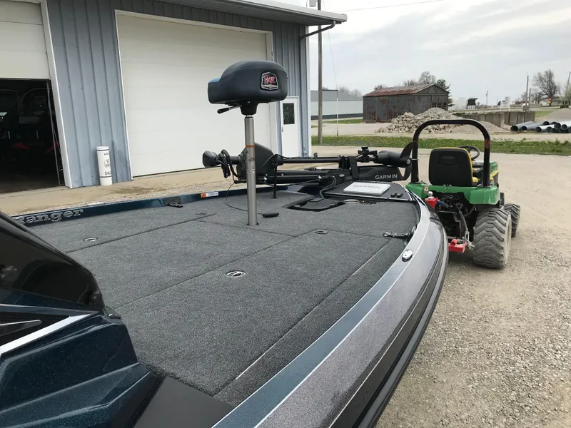 Slide: The Image of 2025 Ranger Z519 Garmin Ranger Cup boat on trailer near garage. - 16