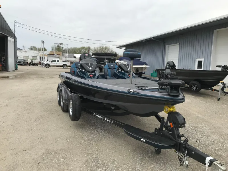 Slide: The Image of 2025 Ranger Z519 Garmin Ranger Cup Equipped boat parked outdoors near silos. - 4