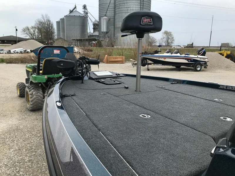 Slide: The Image of 2025 Ranger Z519 Garmin Ranger Cup boat on trailer outside a metal building. - 6