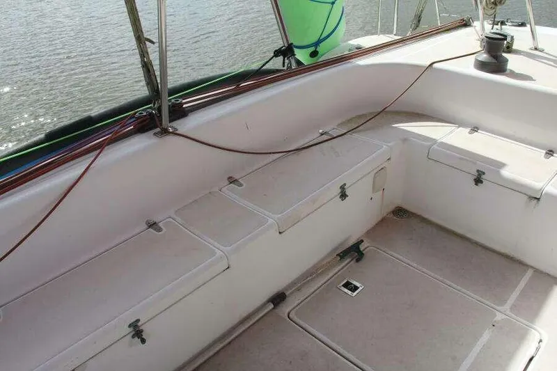 Slide: The Image of 1995 Voyage Yachts Mayotte deck with storage compartments and seating area. - 11