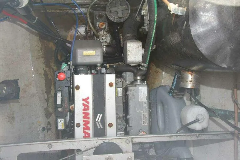 Slide: The Image of Engine compartment of a 1995 Voyage Yachts Mayotte, featuring a Yanmar engine. - 13