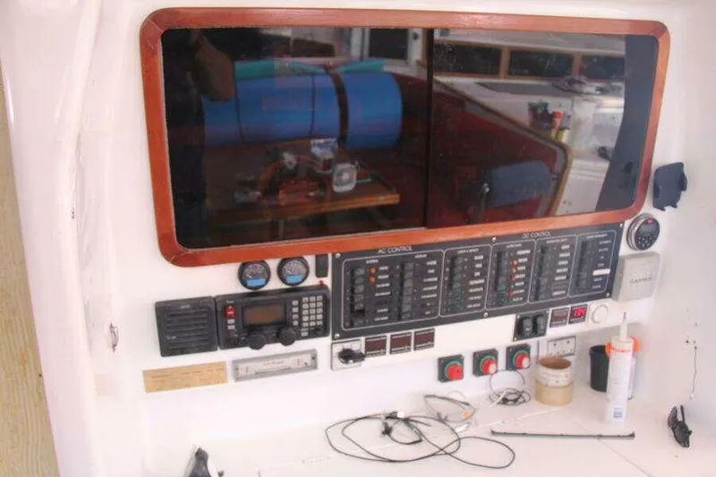 Slide: The Image of Control panel of a 1995 Voyage Yachts Mayotte, featuring navigation and communication equipment. - 17
