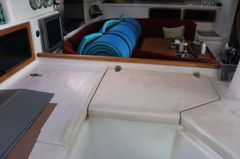 Slide: The Image of Interior of 1995 Voyage Yachts Mayotte with seating and rolled mats. - 25