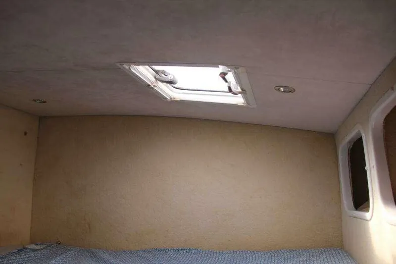 Slide: The Image of Interior cabin of 1995 Voyage Yachts Mayotte with skylight and windows. - 31