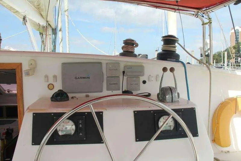 Slide: The Image of Steering console of 1995 Voyage Yachts Mayotte catamaran with Garmin navigation system. - 9