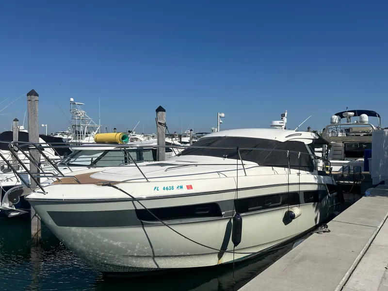 Slide: The Image of 2018 Bavaria S40 Coupe yacht docked at marina under clear blue sky. - 1