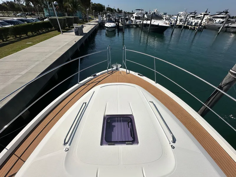 Slide: The Image of 2018 Bavaria S40 Coupe yacht docked at marina, showcasing sleek deck design. - 18