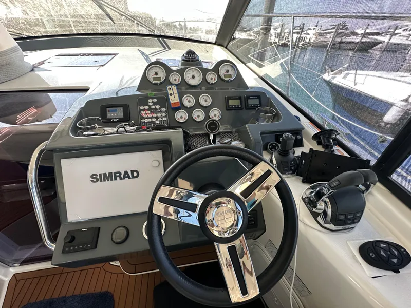 Slide: The Image of Helm of 2018 Bavaria S40 Coupe with Simrad navigation system and modern controls. - 32