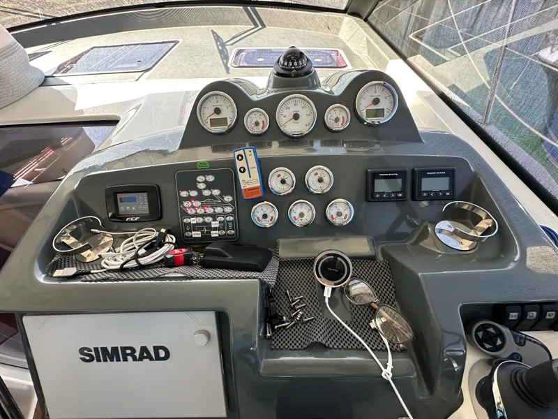 Slide: The Image of Control panel of a 2018 Bavaria S40 Coupe boat with gauges and navigation equipment. - 33