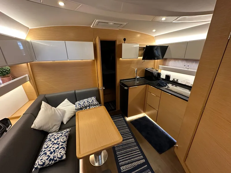 Slide: The Image of Interior of 2018 Bavaria S40 Coupe yacht with modern kitchen and cozy seating area. - 35