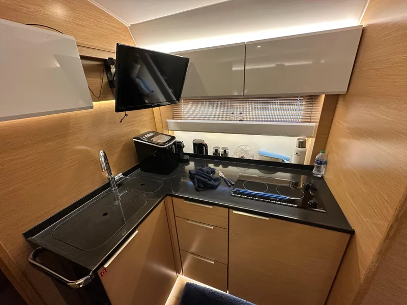 Slide: The Image of Modern kitchen in 2018 Bavaria S40 Coupe yacht with sleek cabinetry and appliances. - 38