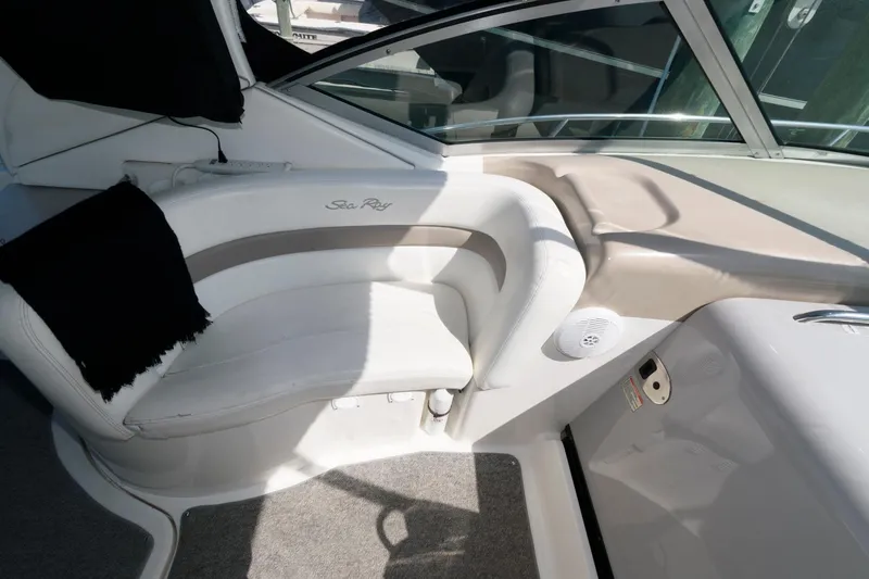 Slide: The Image of Interior seating of 2003 Sea Ray 320 Sundancer boat, featuring white upholstery. - 8