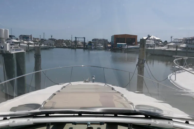 Slide: The Image of View from a 2003 Sea Ray 320 Sundancer yacht in a marina. - 9