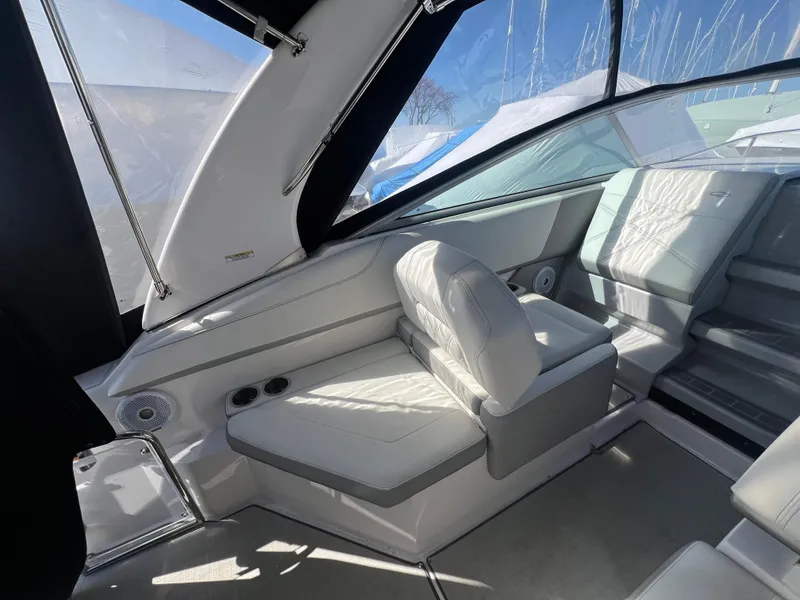 Slide: The Image of Interior of a 2020 Regal 26 XO boat with white seating and modern design. - 13