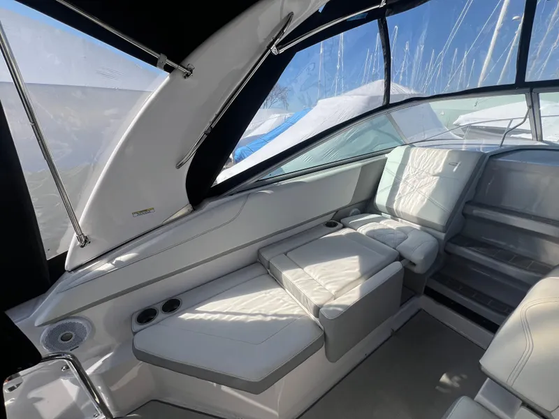 Slide: The Image of Interior of a 2020 Regal 26 XO boat with white seating and modern design. - 14